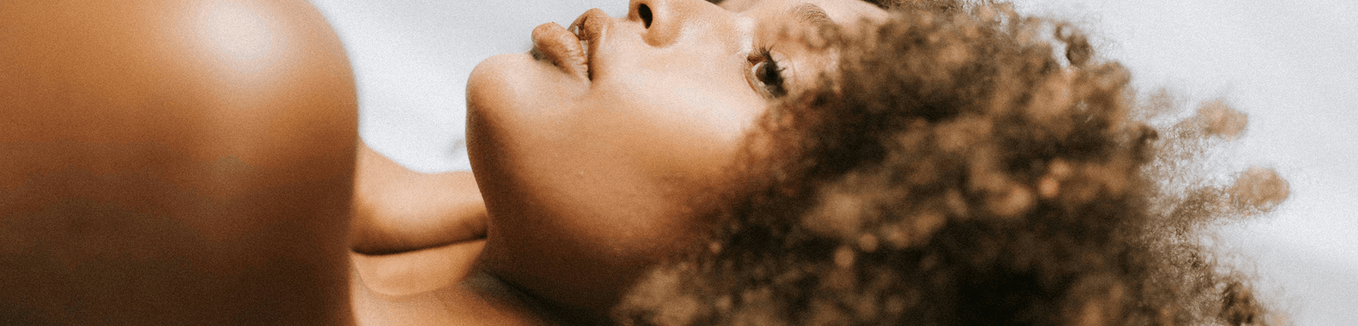 A room corner with shadows from window blinds creating a calm atmosphere